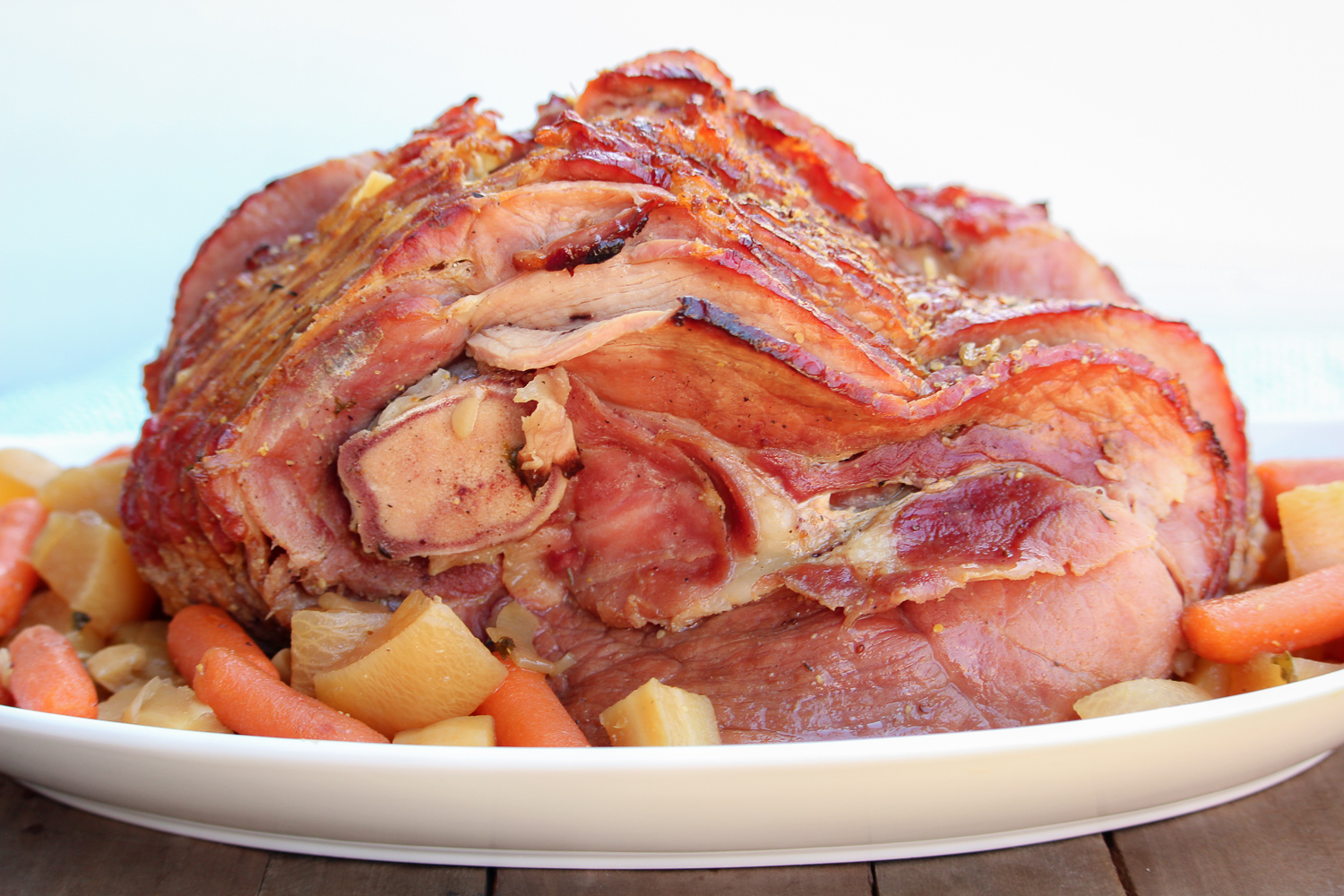 Ham and vegetables on a white plate ready to serve.
