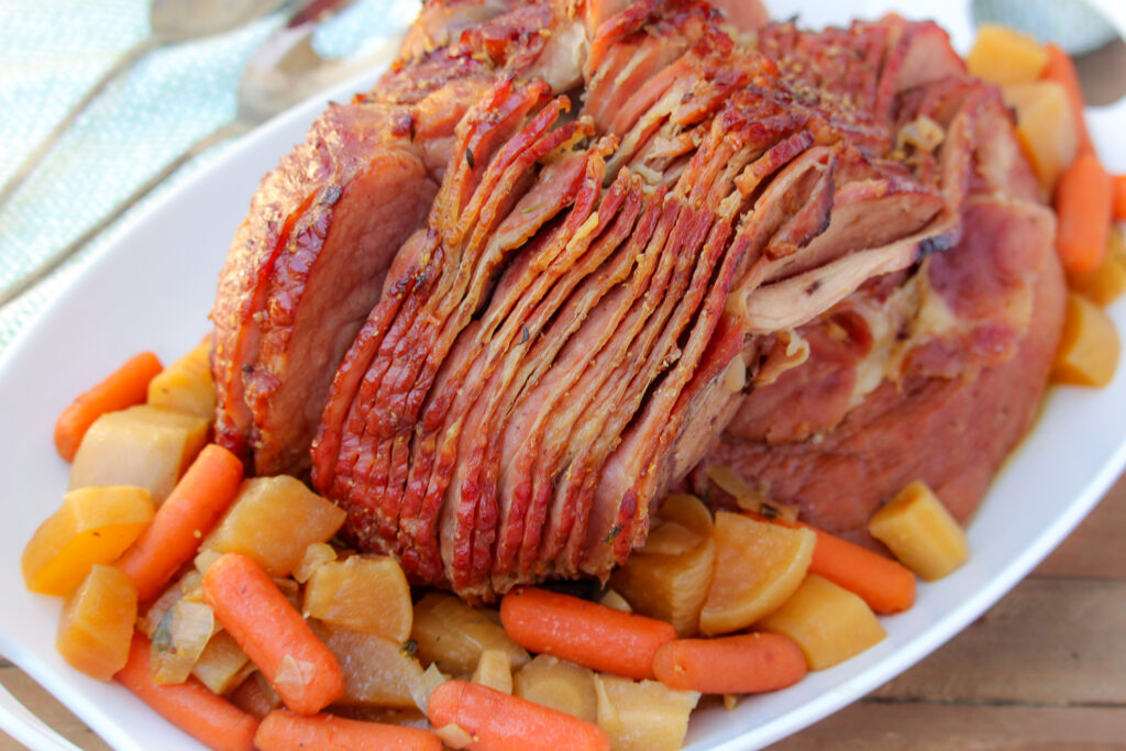 Ham and vegetable on a white plate ready to serve.