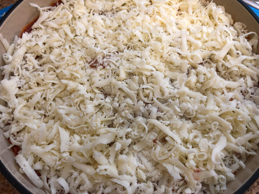 Shredded mozzarella has been added to the dutch oven pizza pasta. 