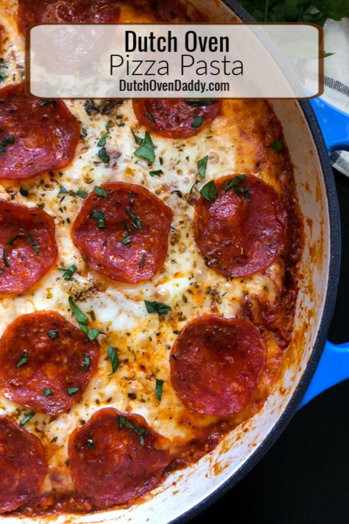 Close up side view of Dutch Oven Pizza Pasta garnished with fresh parsley. 