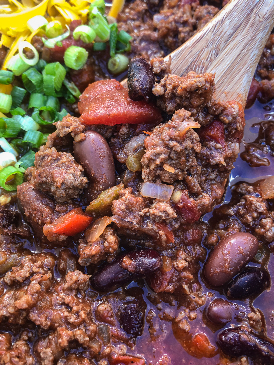 Super close up of a spoonful of dutch oven awesome chili. 