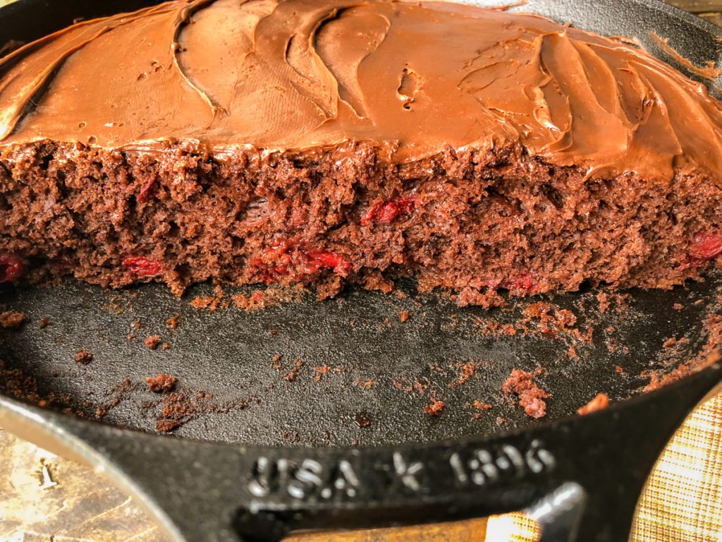 Inside and side view of the chocolate cherry cake in the skillet.