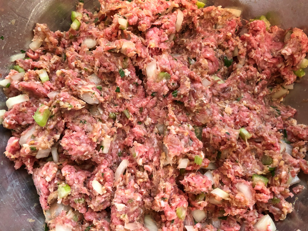 All the ingredients for the meatloaf have been combined in a large bowl. 