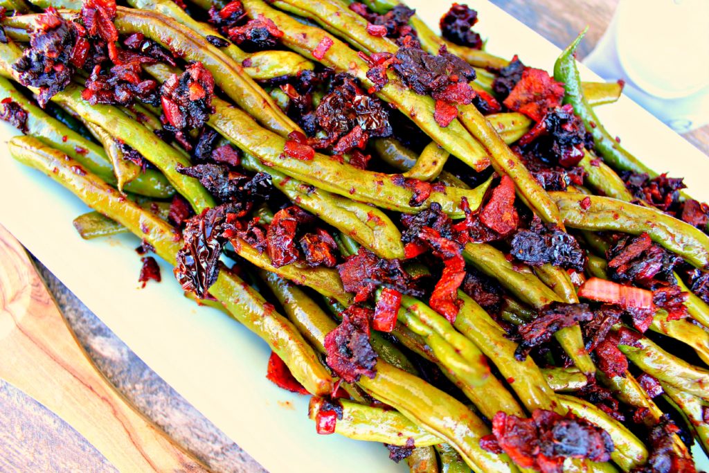 Fresh green beans tossed with bacon and sun-dried tomatoes. 