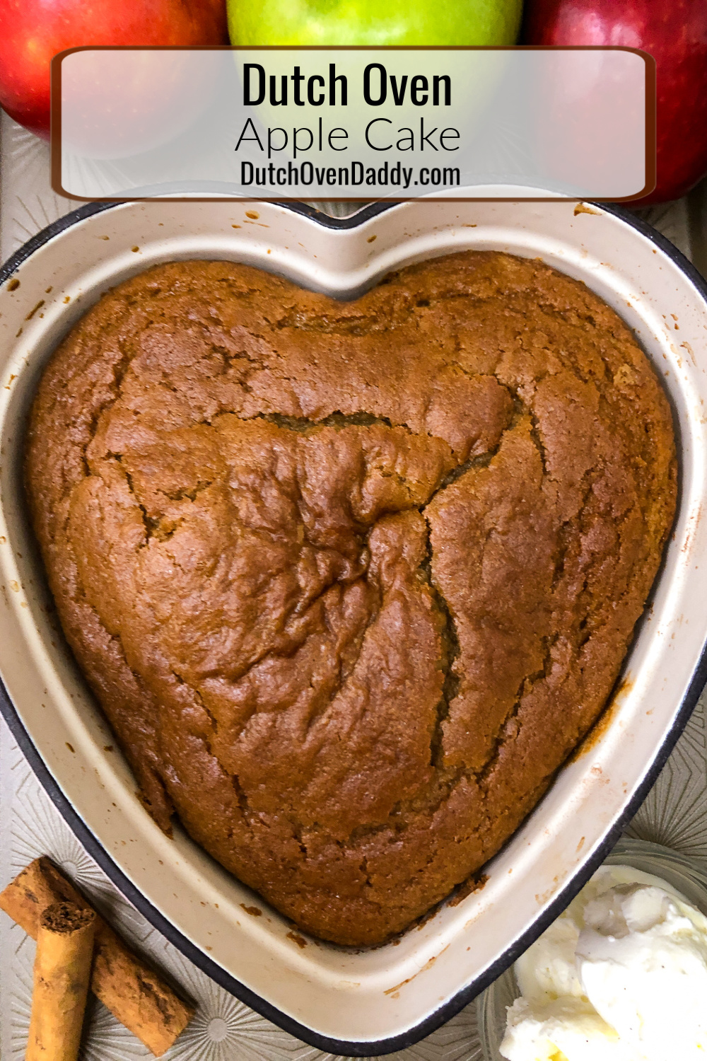 Freshly baked apple cake in a heart-shaped enamel dutch oven 