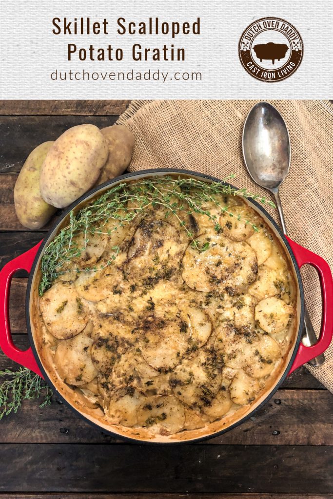 Branded Image of Skillet Scalloped Potato Gratin garnished with fresh thyme. 