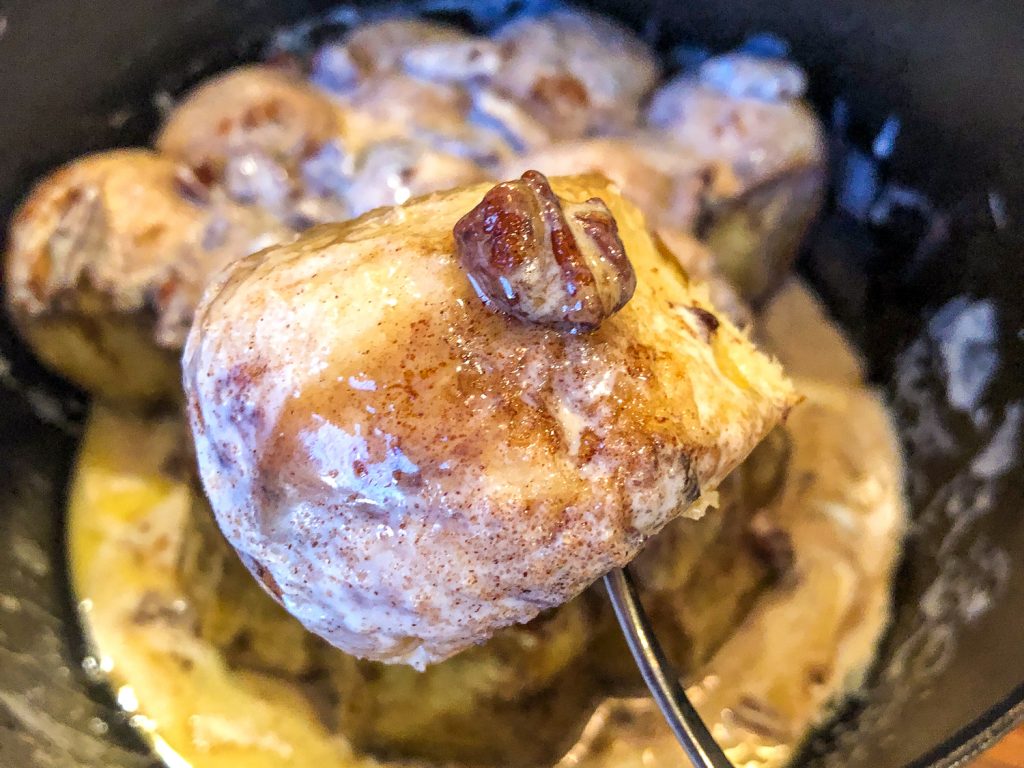 A speared baked cinnamon hole on a fork.