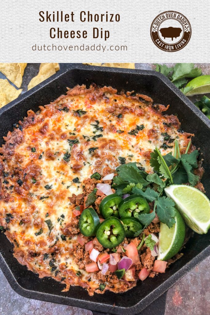 Branded image of skillet chorizo cheese dip garnished with jalapeños, lime wedges, fresh salsa, and cilantro.