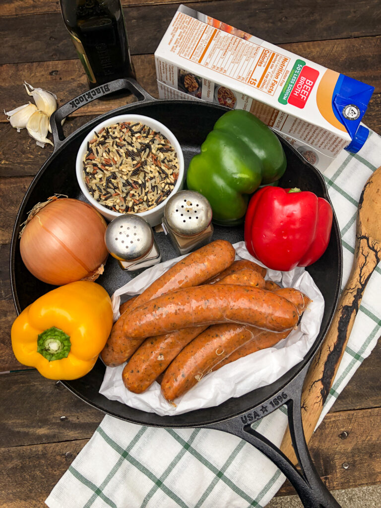 Ingredients needed: olive oil, bell peppers, onion, garlic, salt, pepper, wild rice blend, smoked Italian sausages, and beef broth.