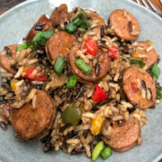 Sausage Onions and Peppers ready to eat on a plate.