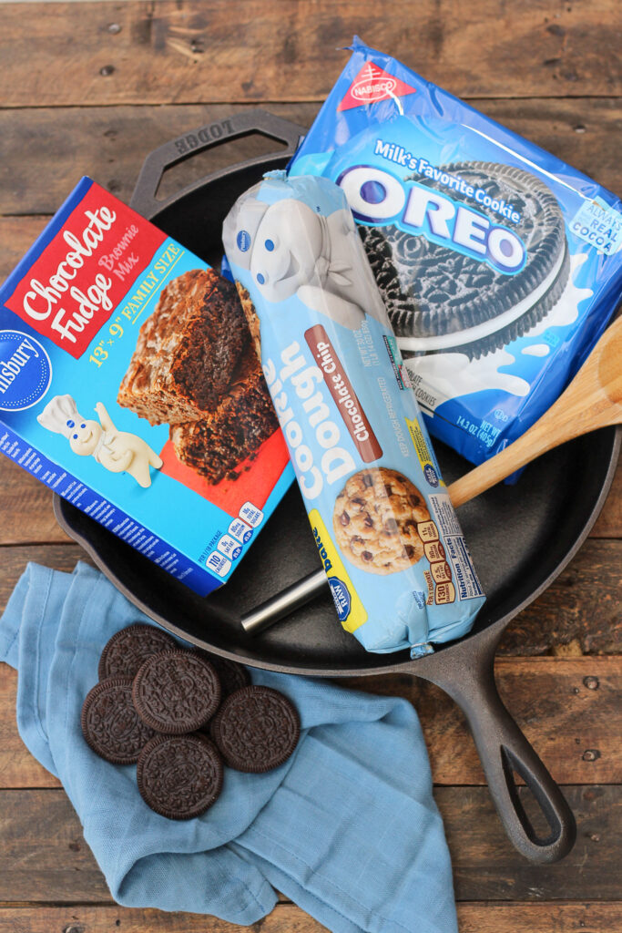 Ingredients to make chewy fudge chocolate brookies placed in a cast iron skillet.