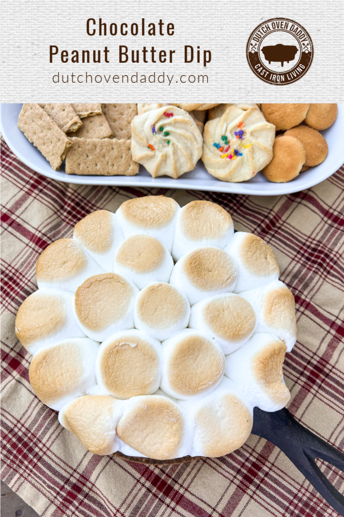 Branded image of Chocolate Peanut Butter dip topped with roasted marshmallows and a plate of various cookies in the background.