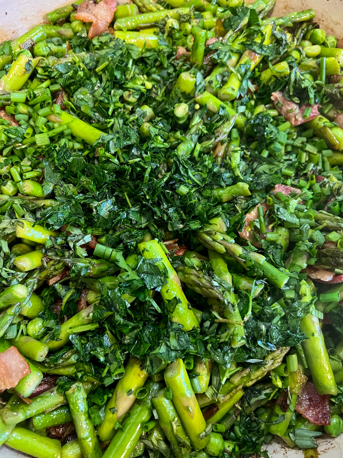 Fresh tarragon, chives, and parsley tossed into the dish.