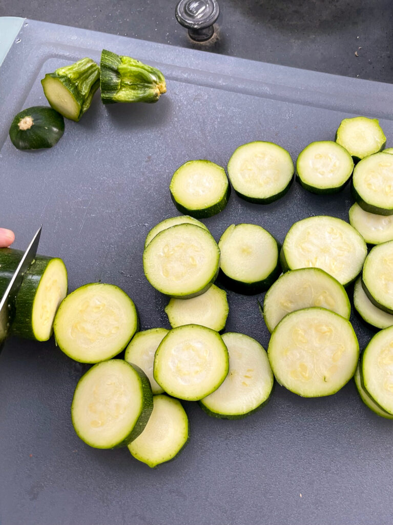 Zucchini being sliced.