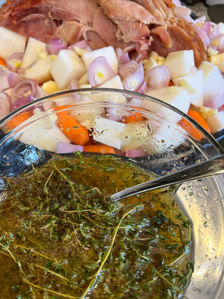 The glaze about to be poured over the ham and drizzled over the vegetables. 