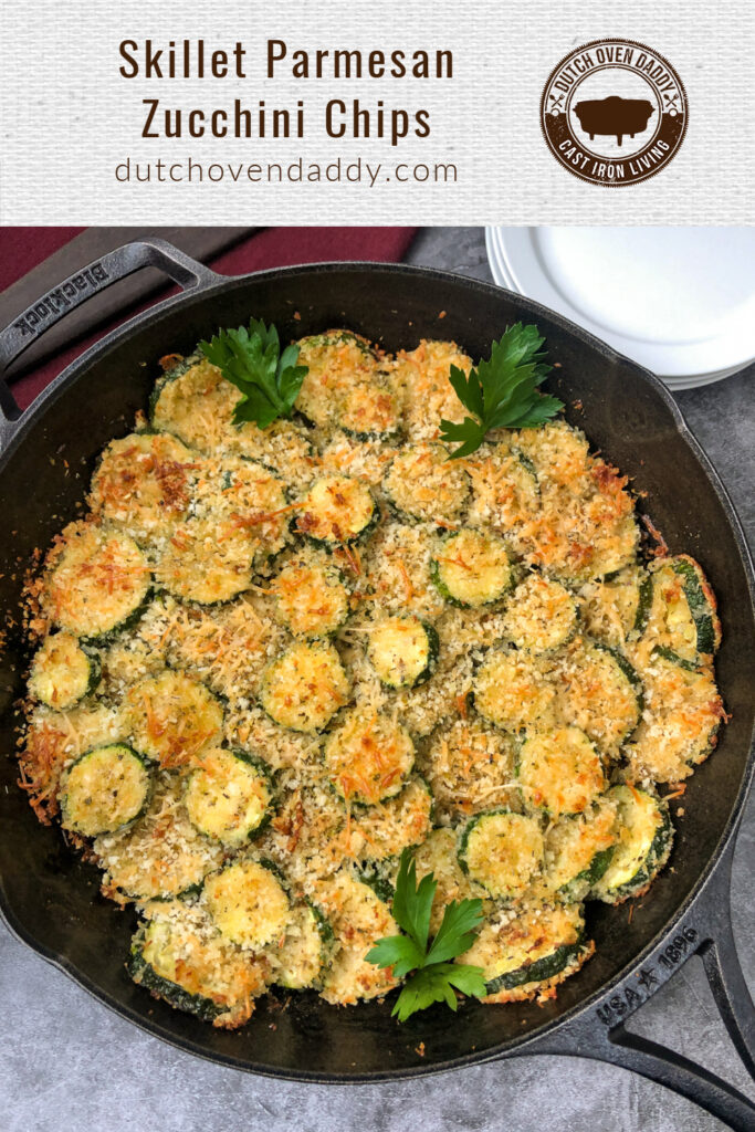 Branded image of Parmesan Zucchini Chips in a cast iron skillet garnished with fresh parsley.