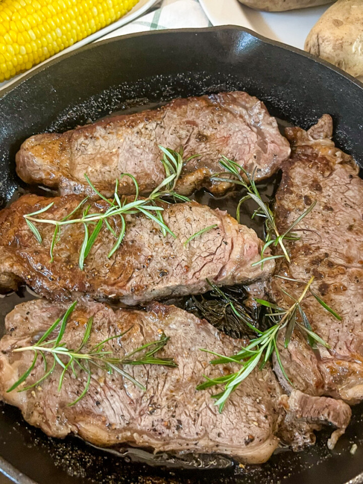 Cast iron steaks in a cast iron skillet.