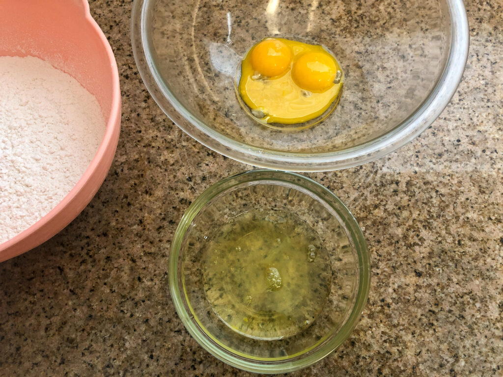 Egg whites and yolks separated and in separate bowls.
