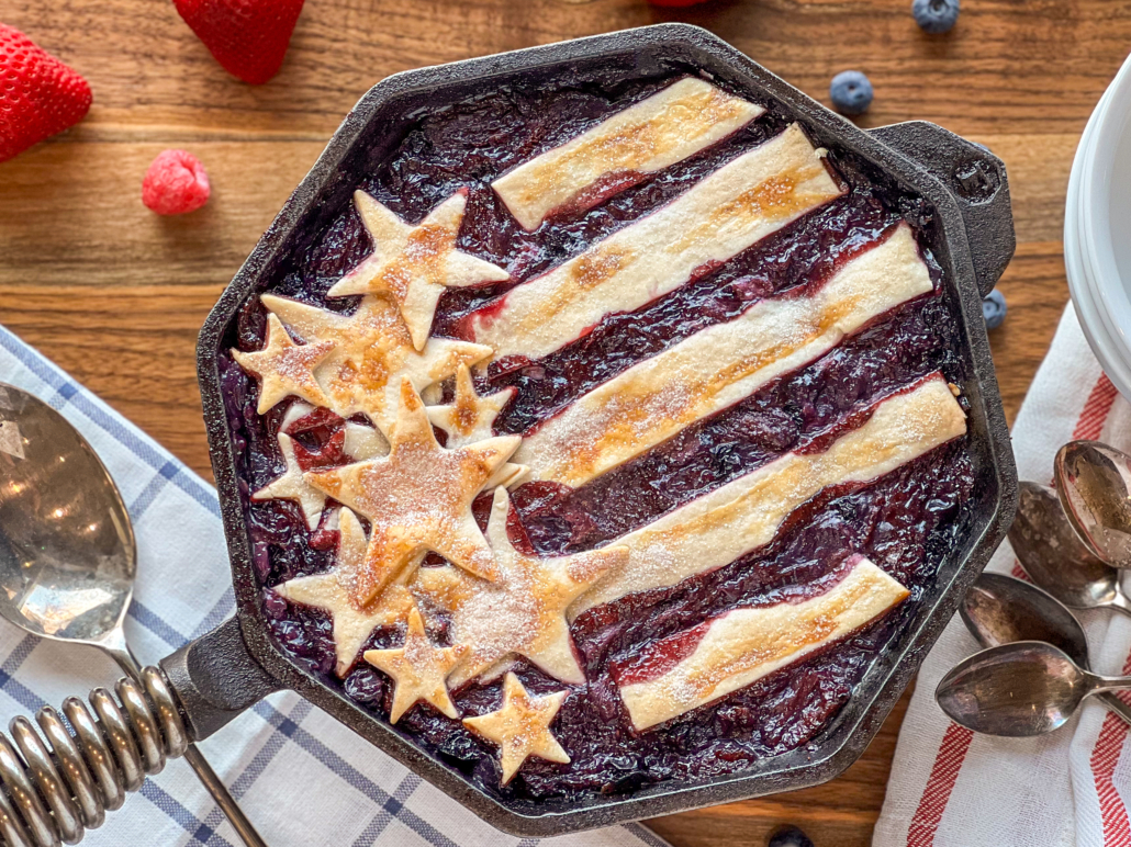 Mixed berry cobbler baked in octagonal shaped 10-inch cast iron skillet.