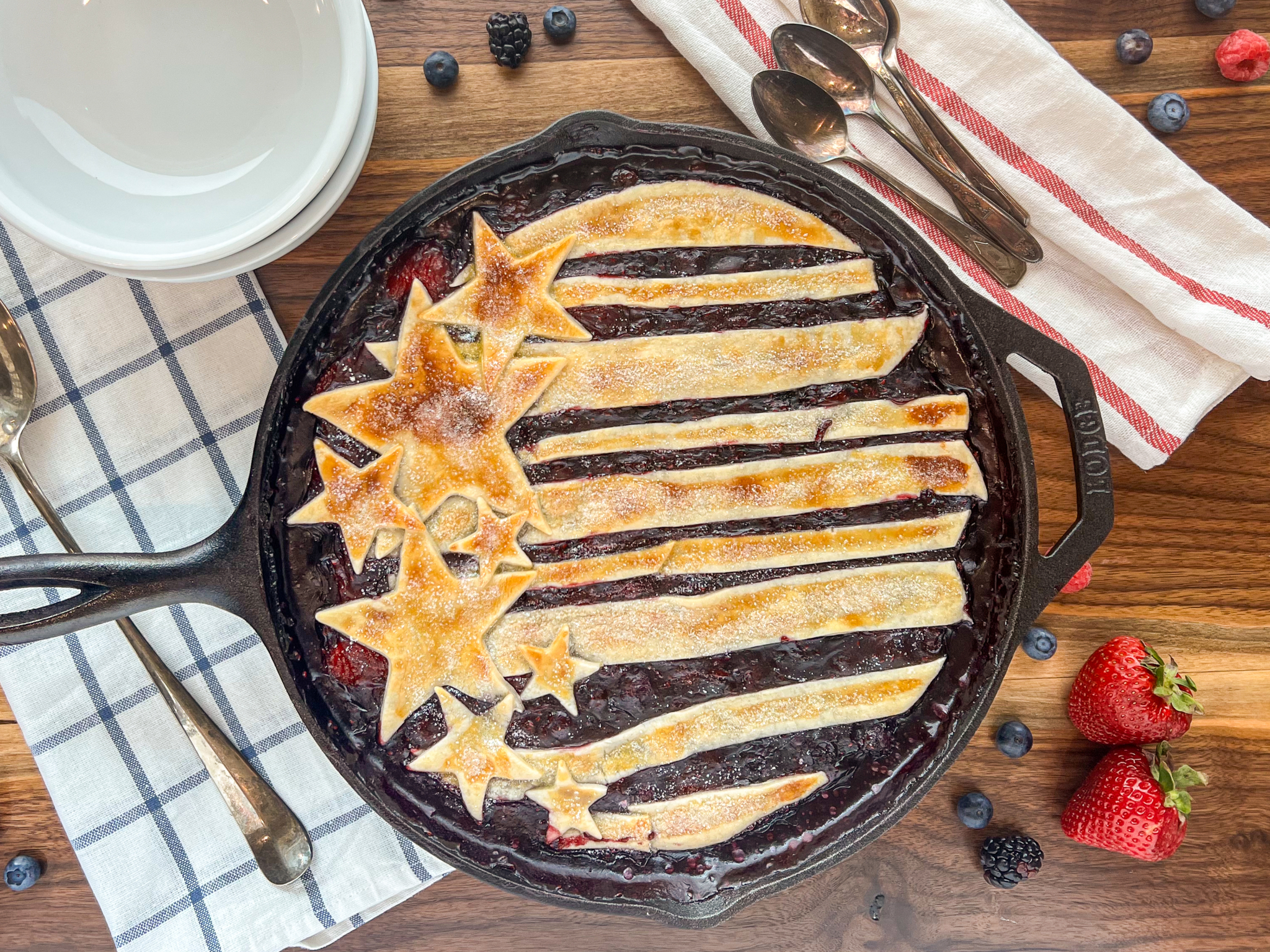 Mixed berry cobbler baked in octagonal shaped 10-inch cast iron skillet.