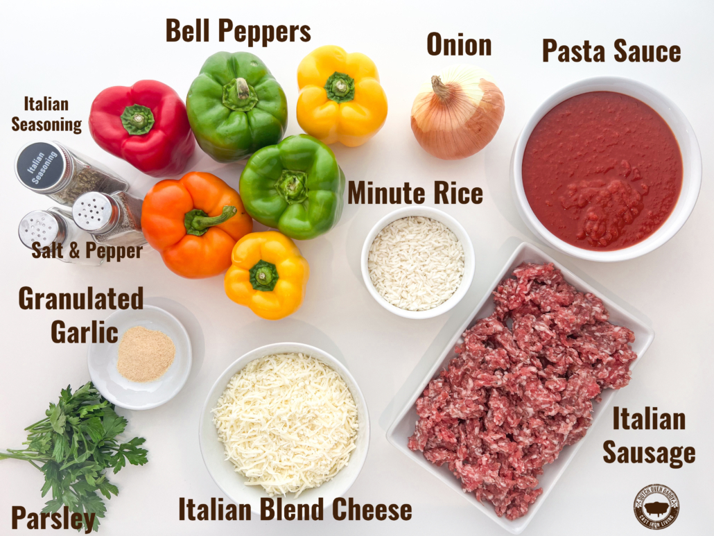 Labeled ingredients for making sausage stuffed peppers: bell peppers, onion, pasta sauce, Minute rice, Italian sausage, Italian blend cheese, parsley, granulated garlic, Italian seasoning, salt, and pepper.
