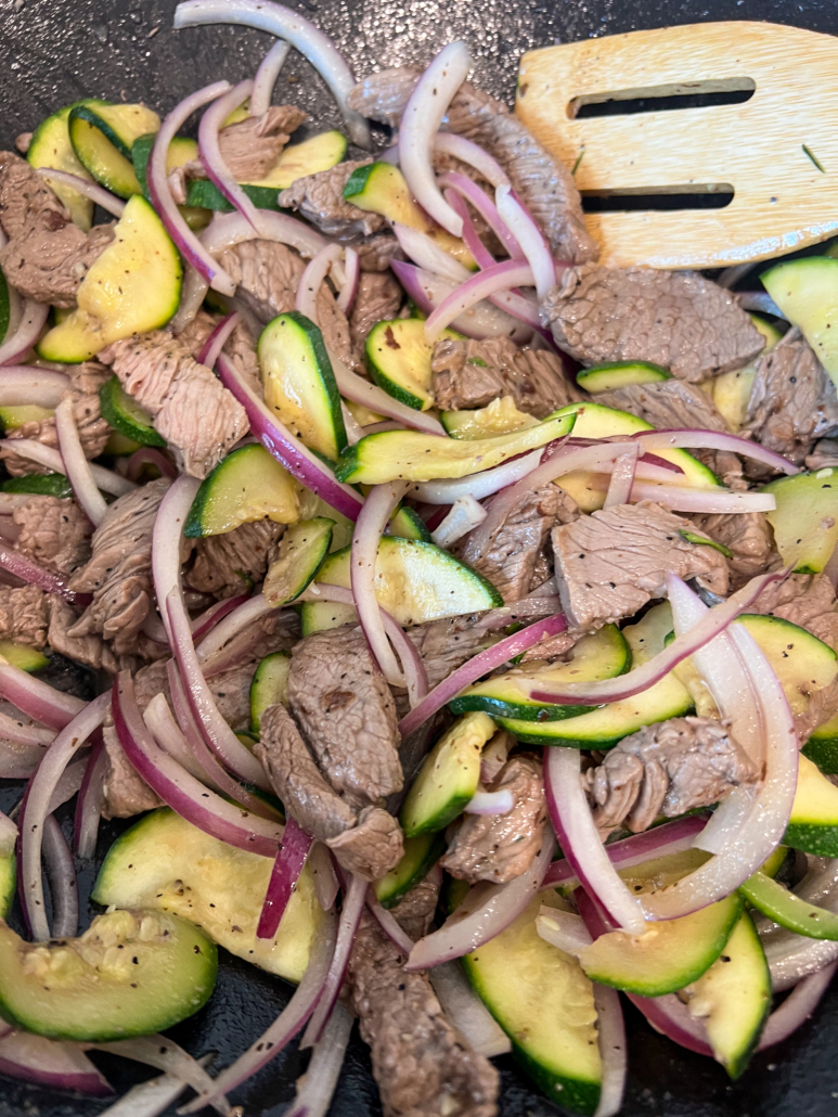 Seasonings have been stirred into the stir fry.