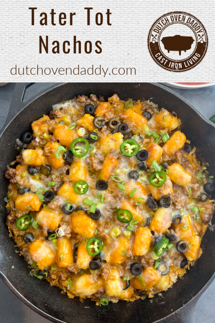 Branded Image of Tater Tot Nachos in a cast iron skillet.