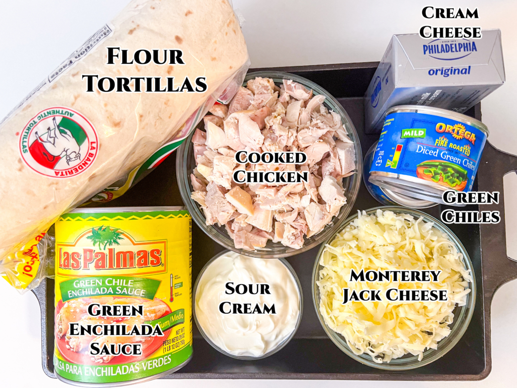 Ingredients to make the recipe: flour tortillas, diced cooked chicken, cream cheese, diced green chiles, green chile enchilada sauce, sour cream, and monterey jack cheese.