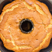 Freshly baked white almond cake still in the cast iron bundt pan.
