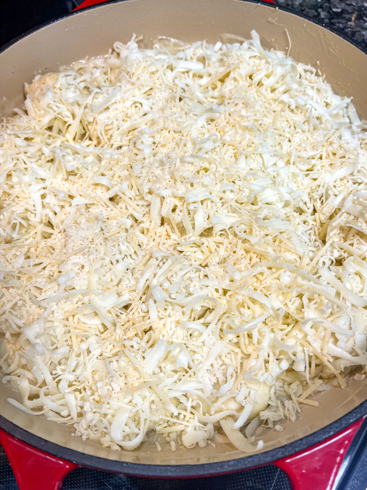 Cheesy Alfredo Pull Aparts in the process of construction. Cheese has been added.