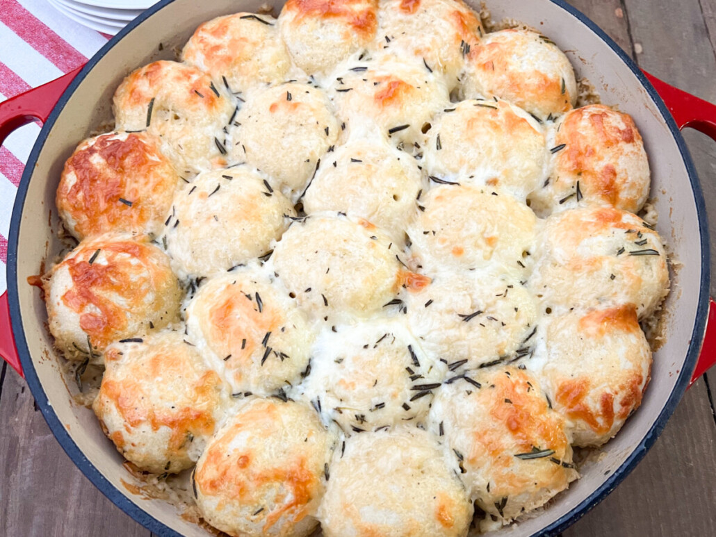 Cheesy Alfredo Pull Aparts fresh out of the oven in an enameled cast iron dutch oven.