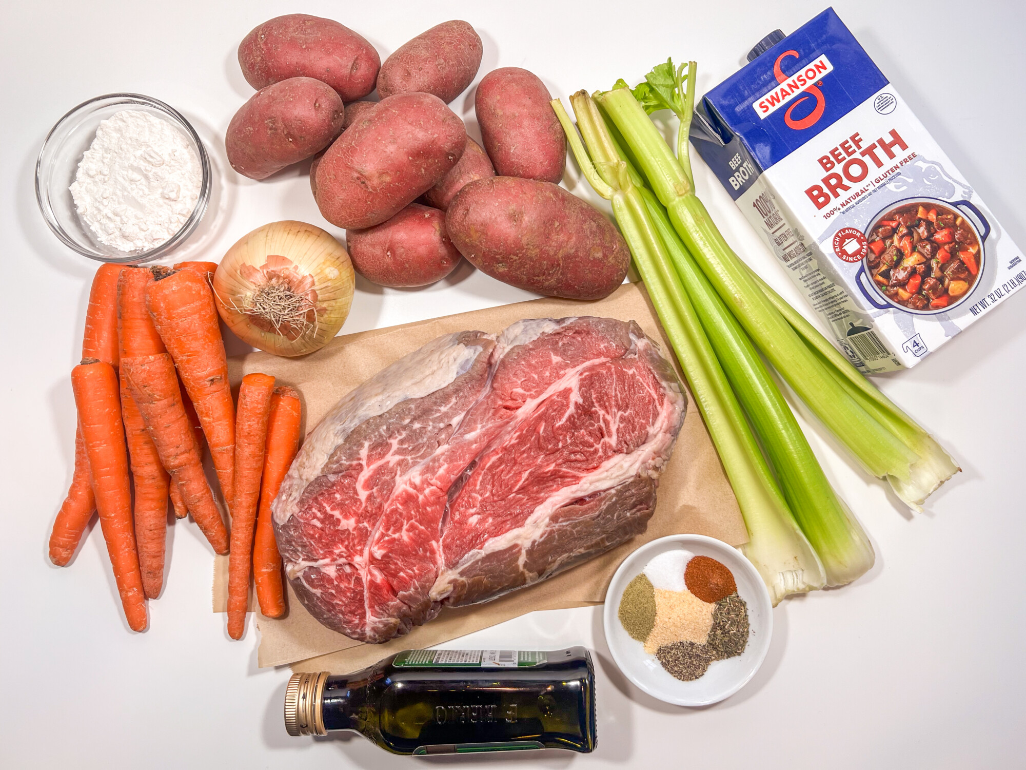 Pot roast ingredients include red potatoes, celery, carrots, onion, chuck roast, beef broth, olive oil, and flour.
