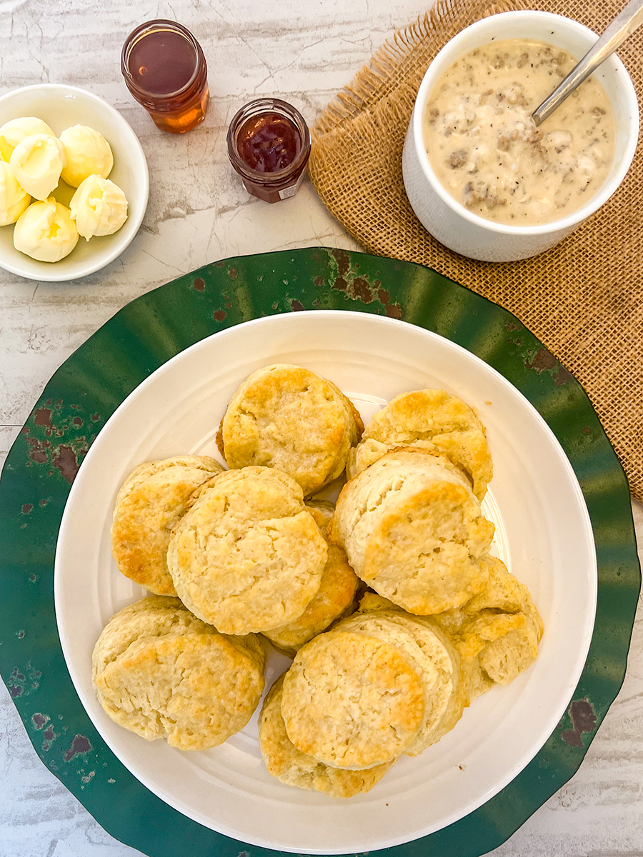 A plate of skillet buttermilk biscuits on the table.