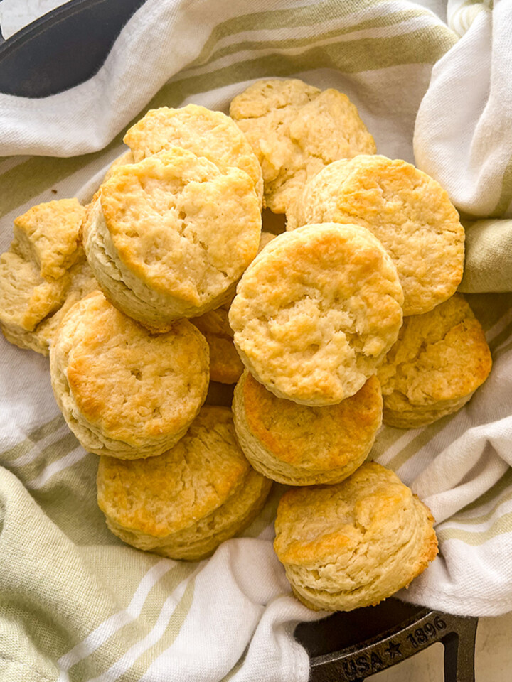 A plate of skillet buttermilk biscuits on the table.