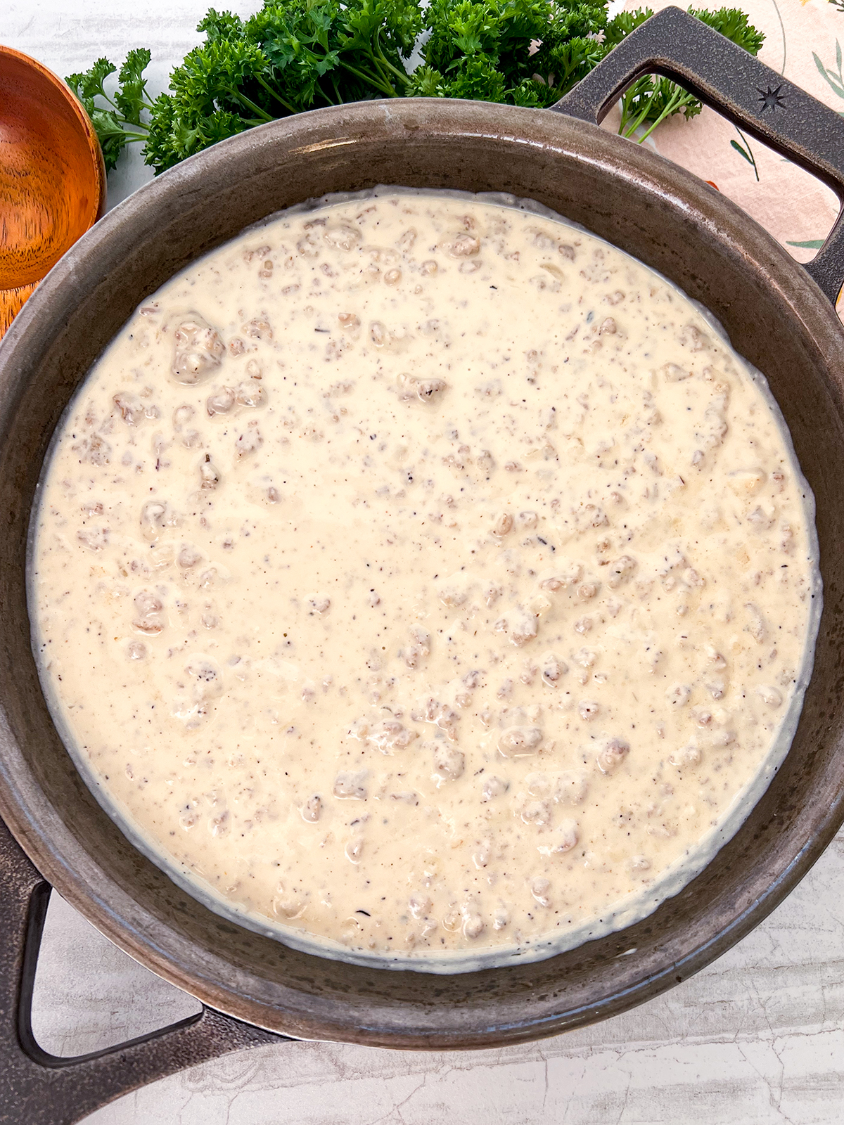 Easy Sausage Gravy in a cast iron skillet.
