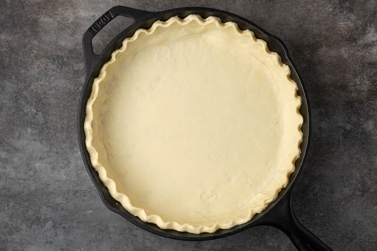 Pie crust shaped into the cast iron skilet. 