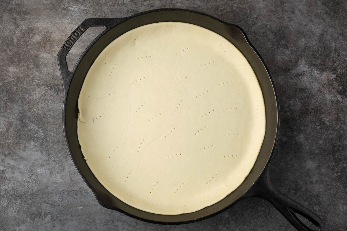Pie crust in a cast iron skillet.
