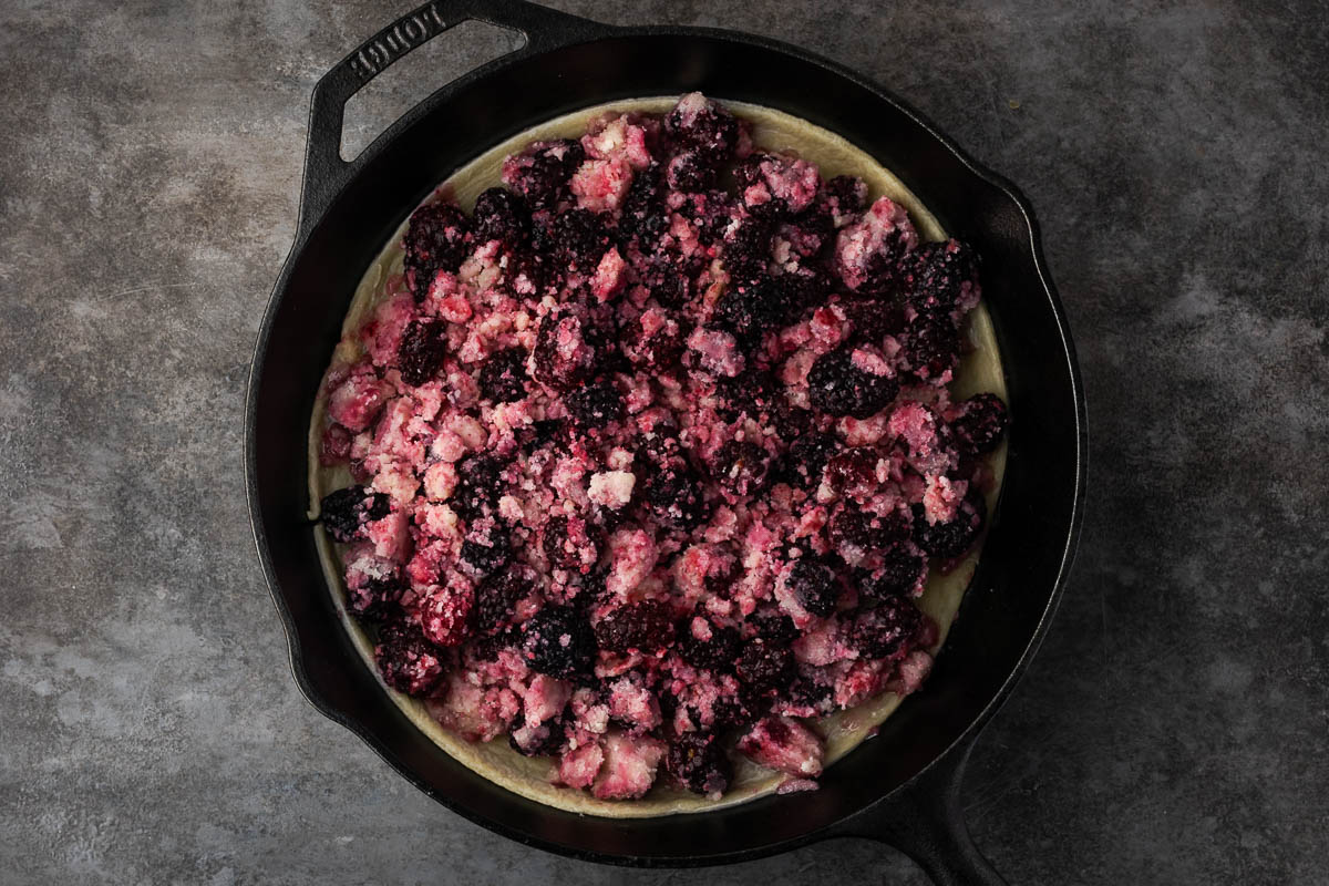 Cobbler mixture added to cast iron skillet.