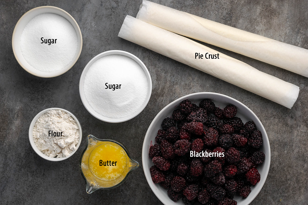 Ingredients to make blackberry cobbler on the table before cooking.