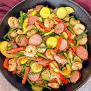 Cajun shrimp and sausage in a skillet.