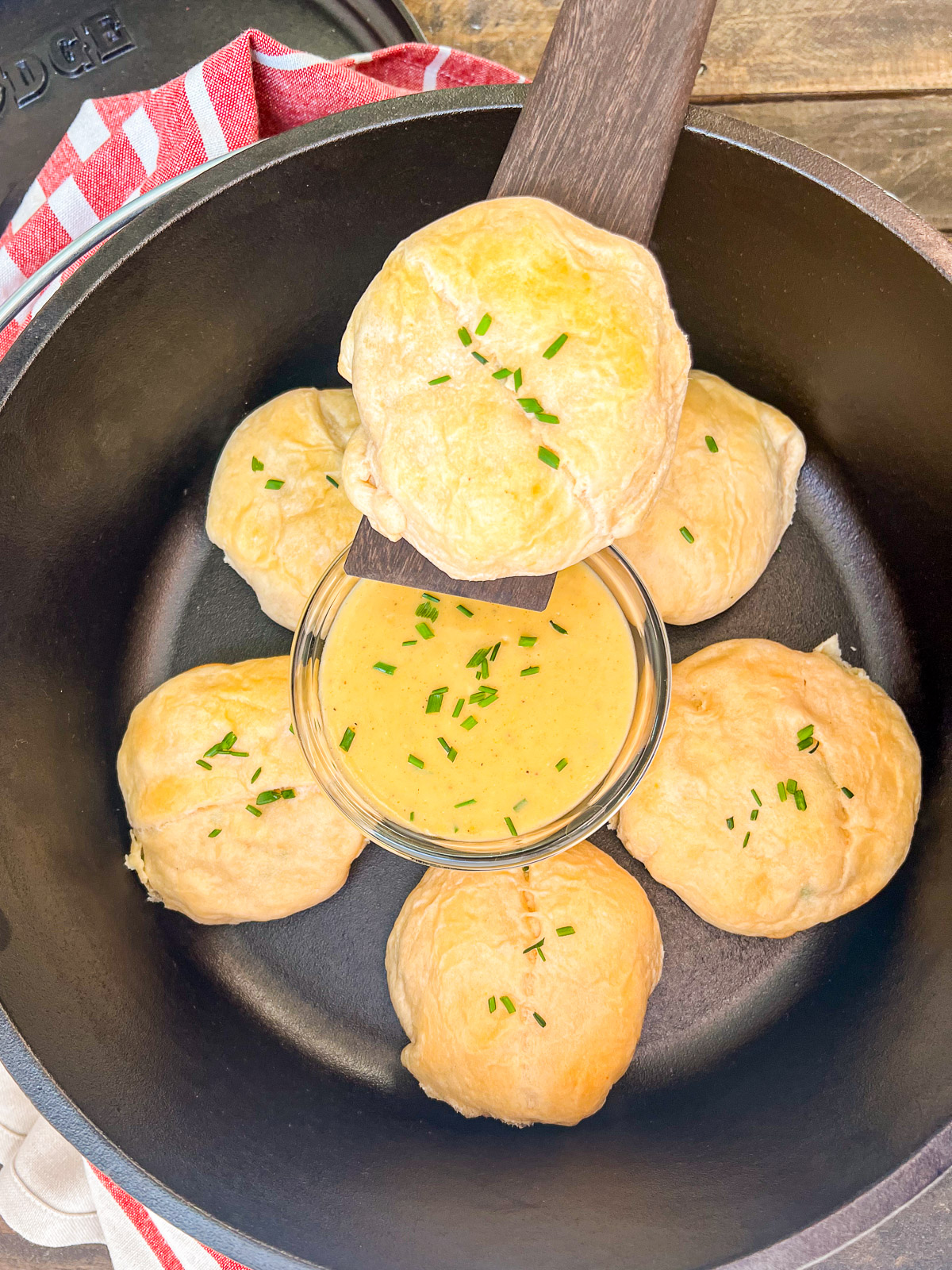 Camp oven of chicken pillows and a bowl of gravy.