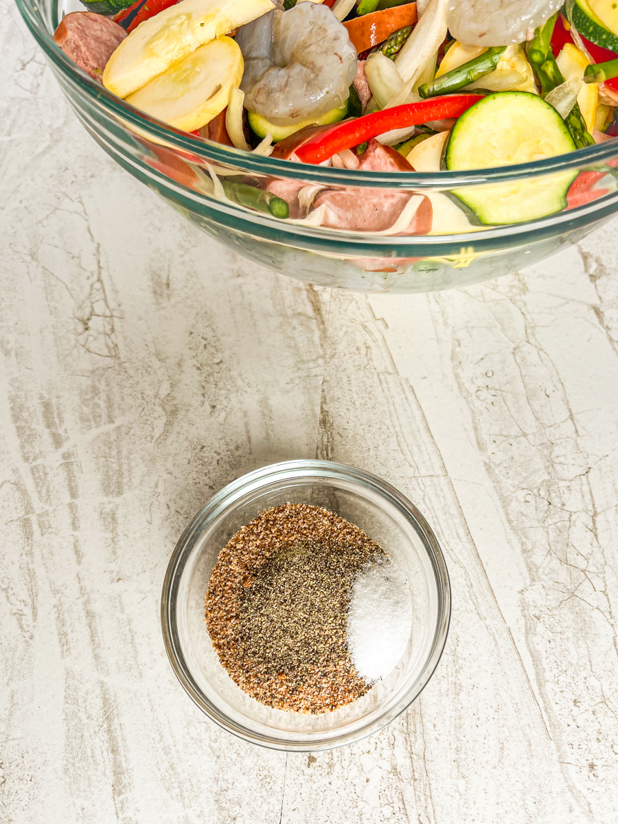 Seasonings in a bowl ready to be mixed into the ingredients for cajun shrimp and sausage. 