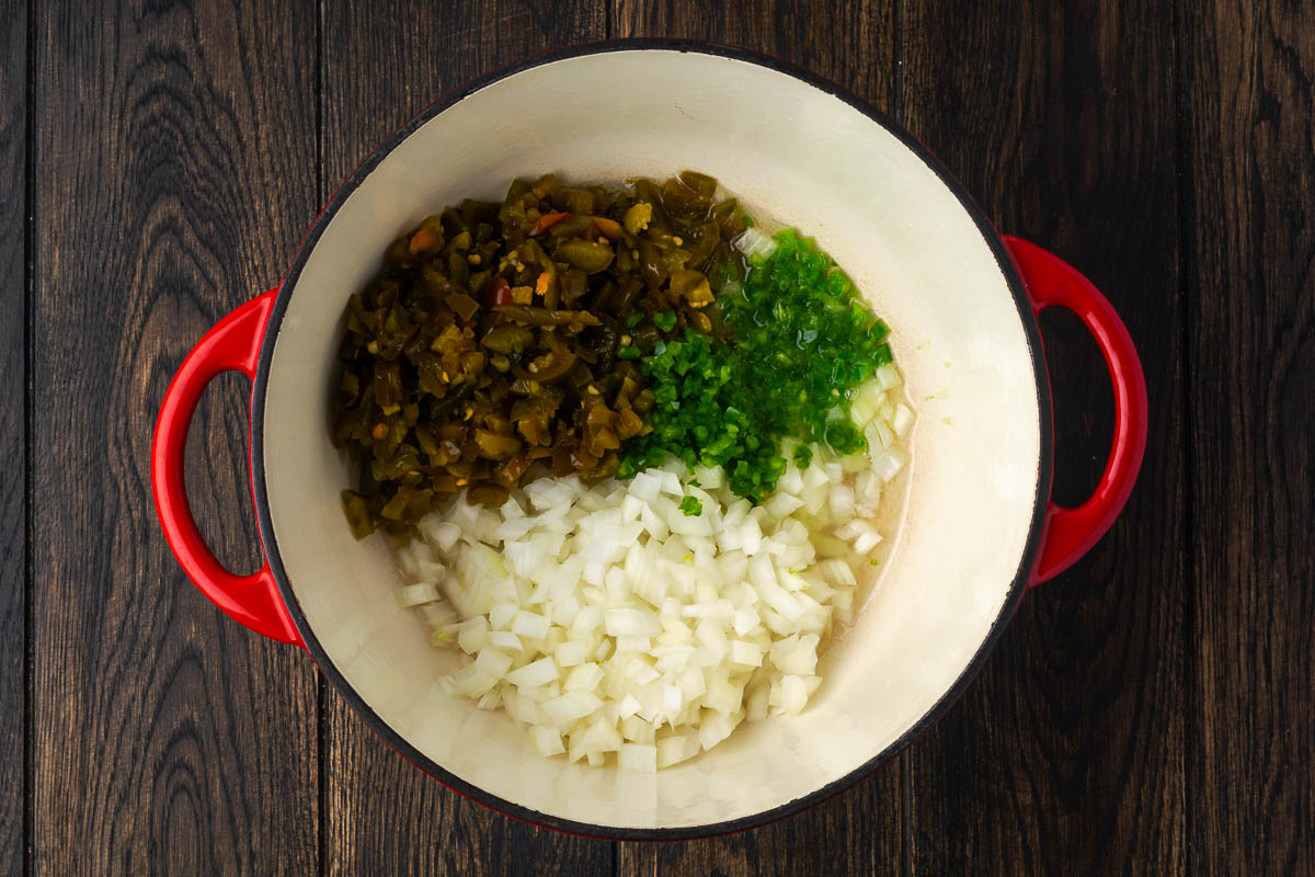 Vegetables added to a Dutch oven to saute.