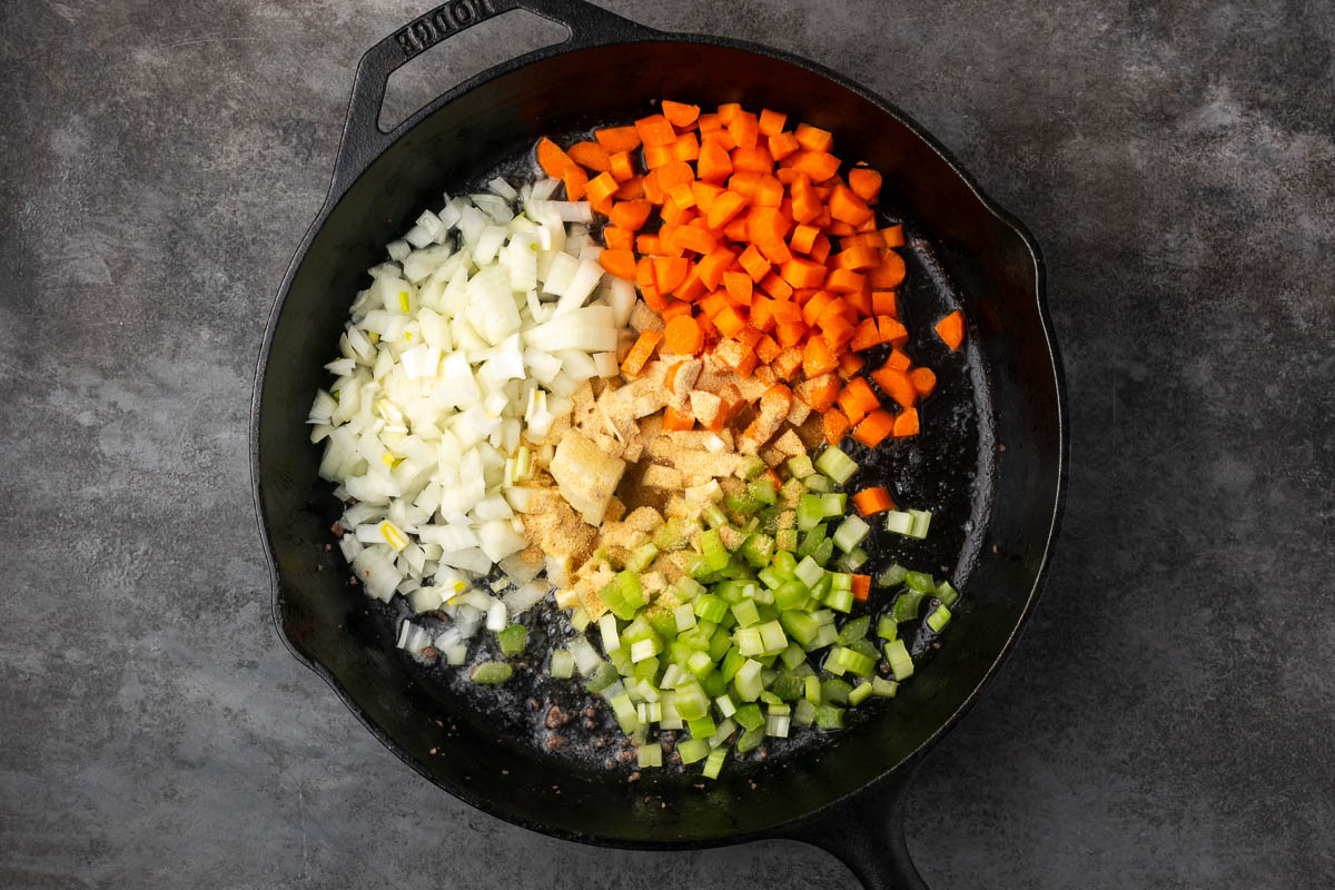 Vegetables cooking in a skillet.