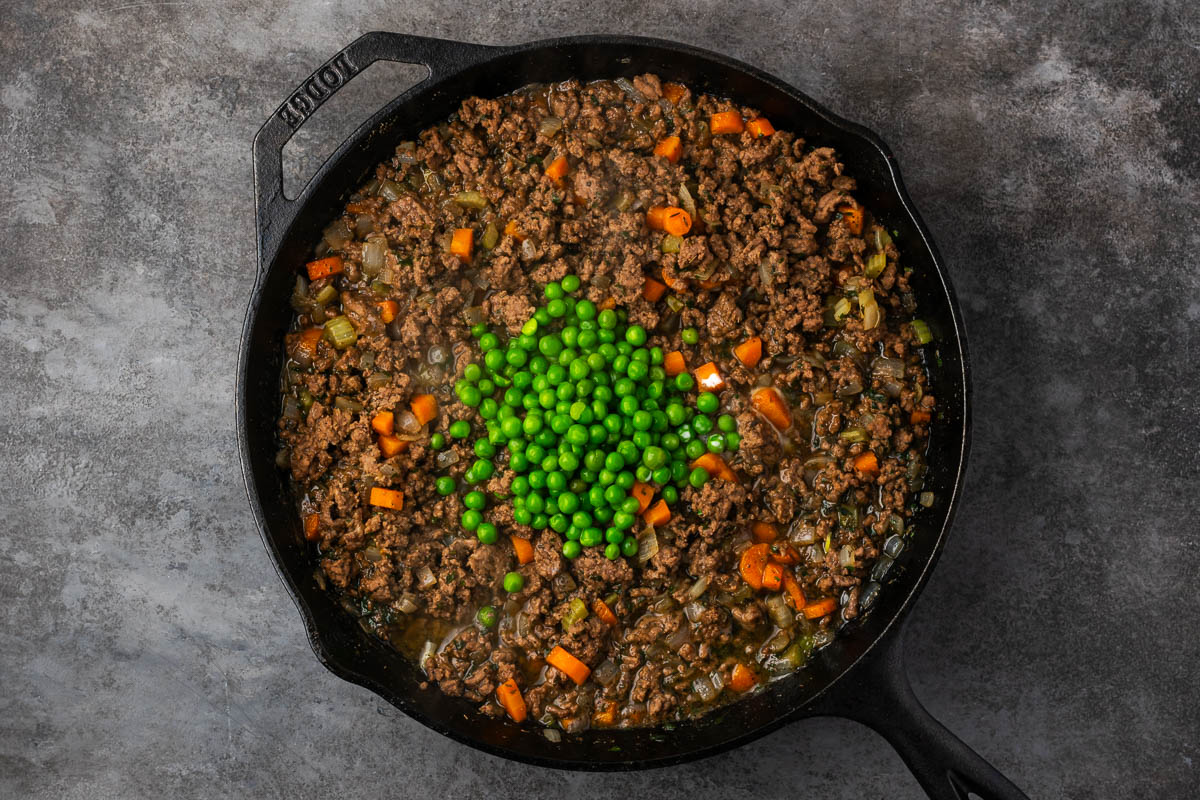 Peas added to the ground beef mixture to make Shepherd's pie.