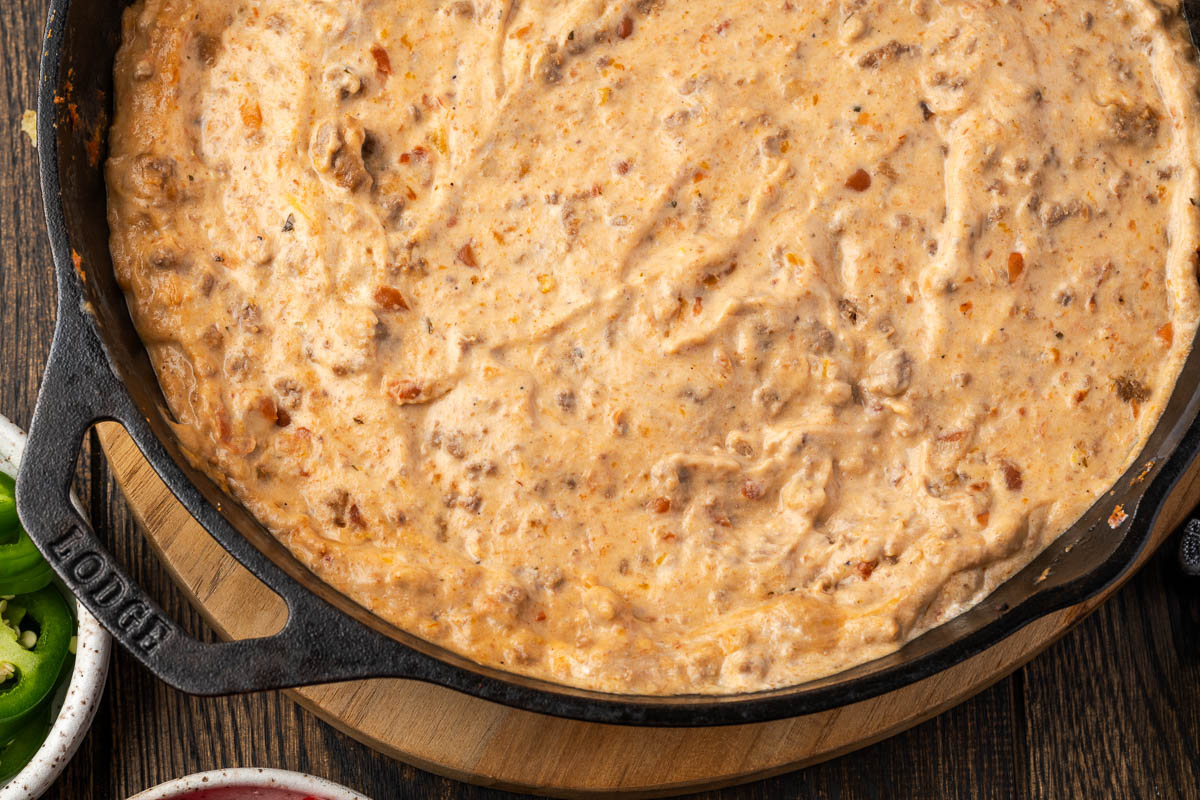 Baked Mexican bean dip in a skillet.