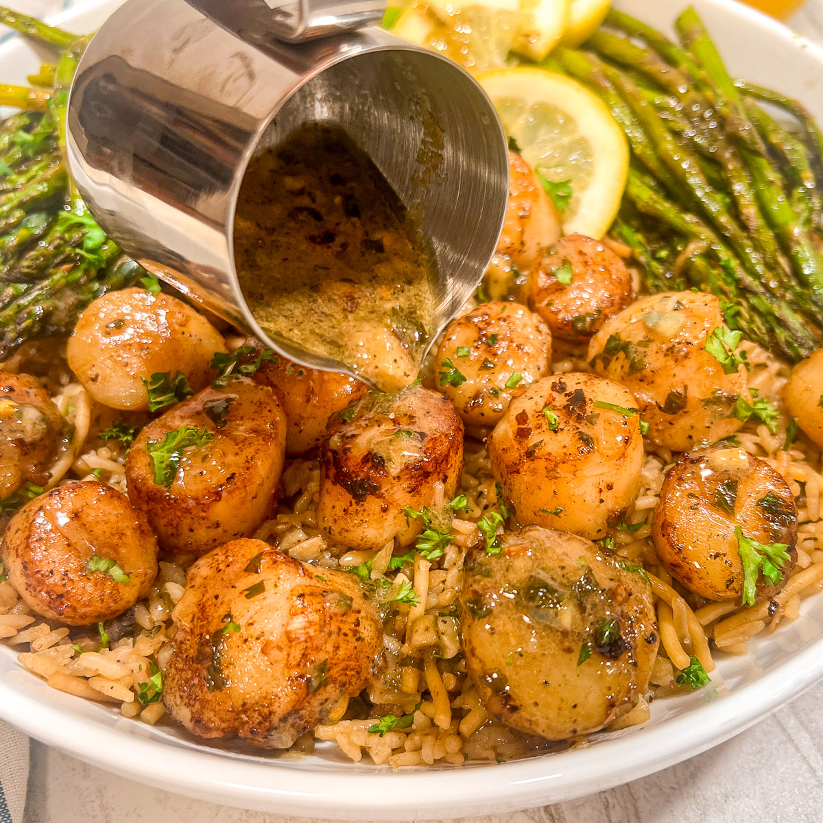 Lemon Butter Seared Scallops plated and ready to serve