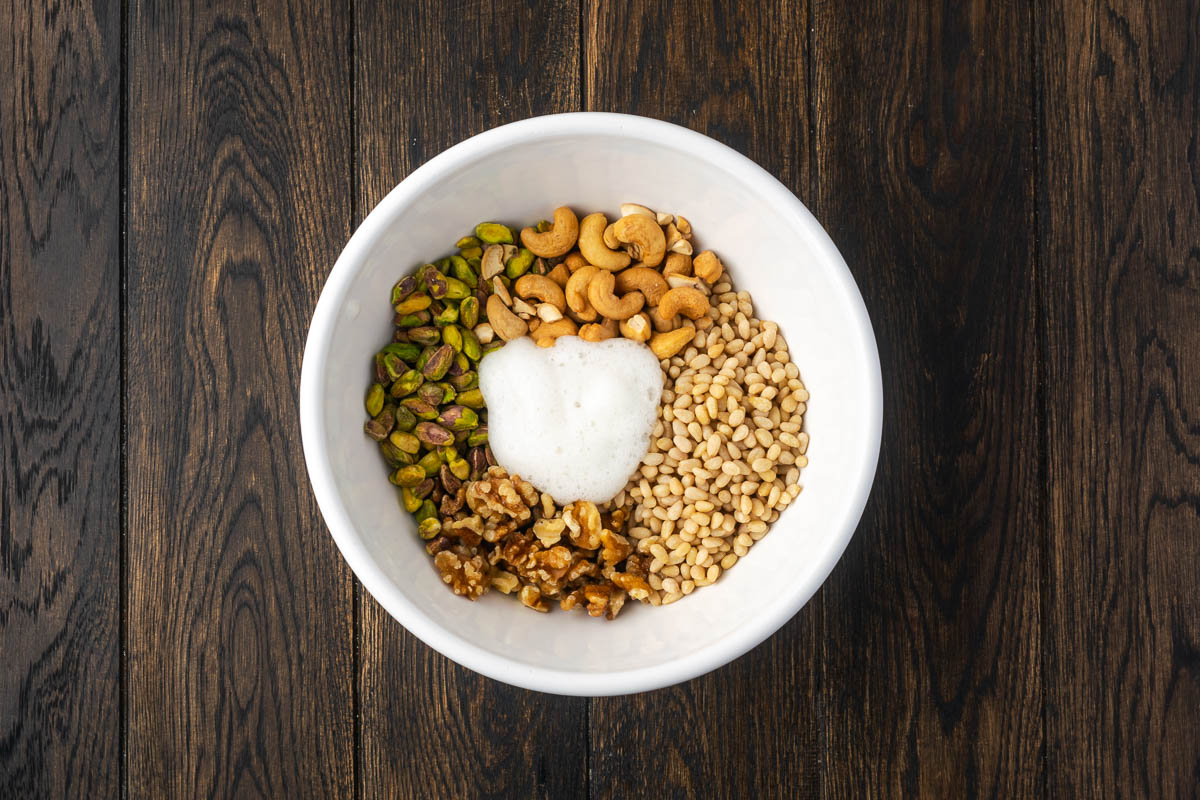 Nuts and egg whites in a bowl.