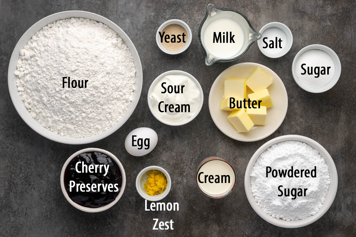 Ingredients to make cherry cinnamon rolls on a table.
