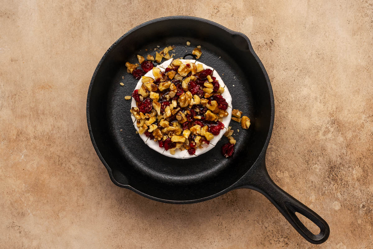Nuts, syrup, and cranberries added on top.